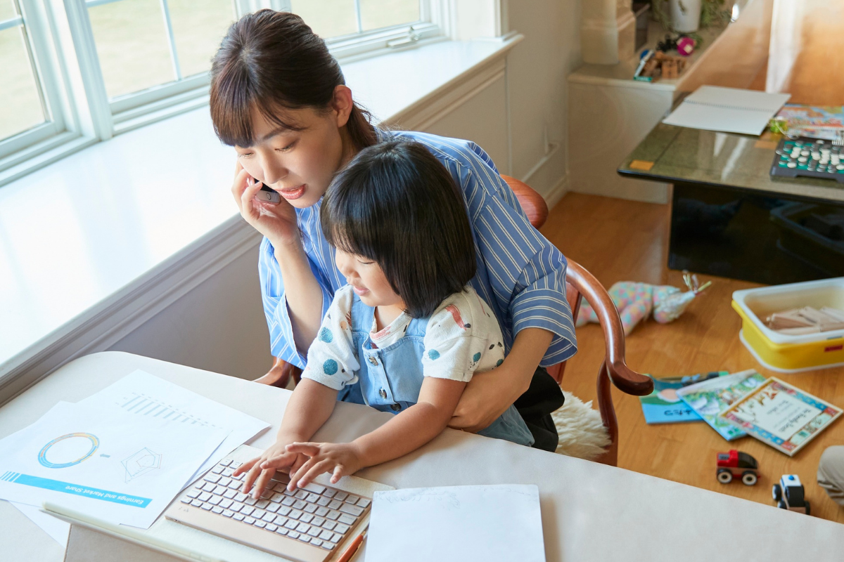 Working parent juggling work with young child